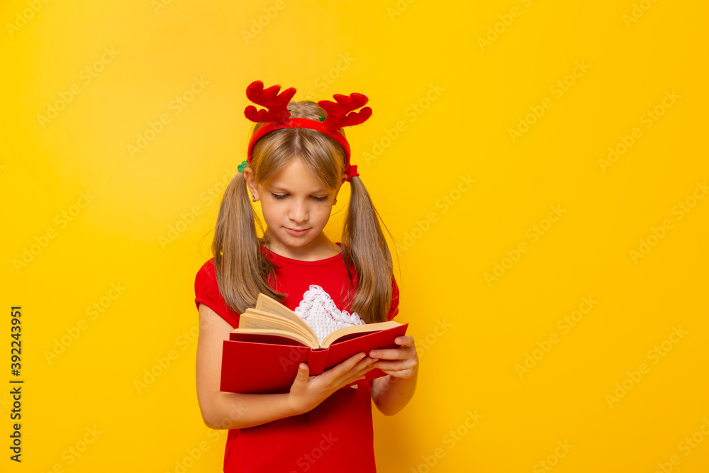 Little girl reading Christmas stories Little girl reading Christmas stories
