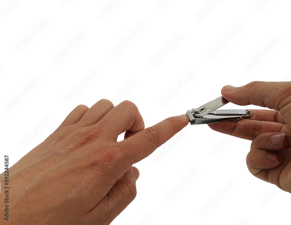 Nail scissors. Cut nail. Cut nails with nail scissors. White background and hand cutting fingernails.