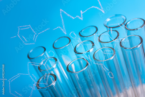 Glass test tubes on blue background,  scientific  laboratory equipment