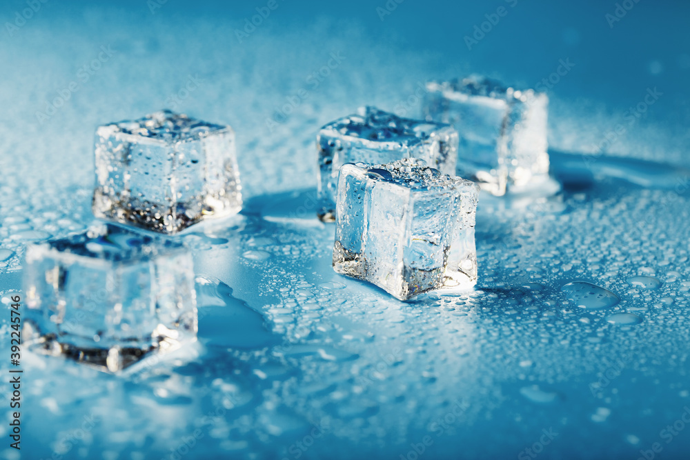 Blocks of Ice With water Drops close-up. Macro ice refreshing cube for a drink on a hot day Blocks of Ice With water Drops close-up. Macro ice refreshing cube for a drink on a hot day