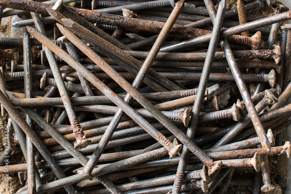 Many old rusted nails. Corroded iron nails closeup background. Recycling iron concept. Many old rusted nails. Corroded iron nails closeup background. Recycling iron concept.