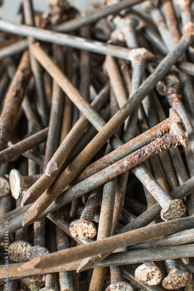 Many old rusted nails. Corroded iron nails background. Recycling iron concept. Closeup view. Many old rusted nails. Corroded iron nails background. Recycling iron concept. Closeup view.
