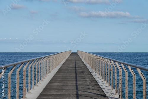 Infinite walkway aligned to the horizon in the middle of the sea