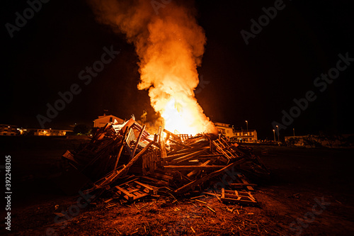 Hoguera de san juan con gran llama de fuego  photo