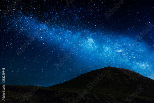 milky way night landscape with mountain black contrast © Raul