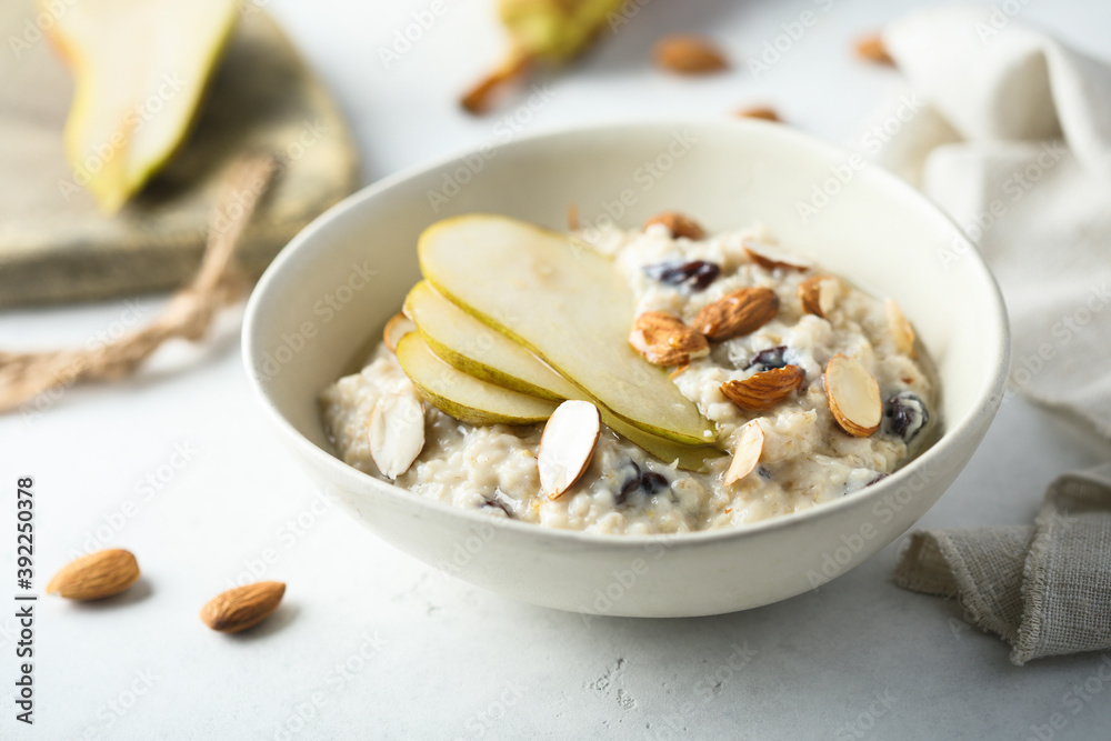 Oatmeal porridge with nuts, raisins and fresh pear Oatmeal porridge with nuts, raisins and fresh pear