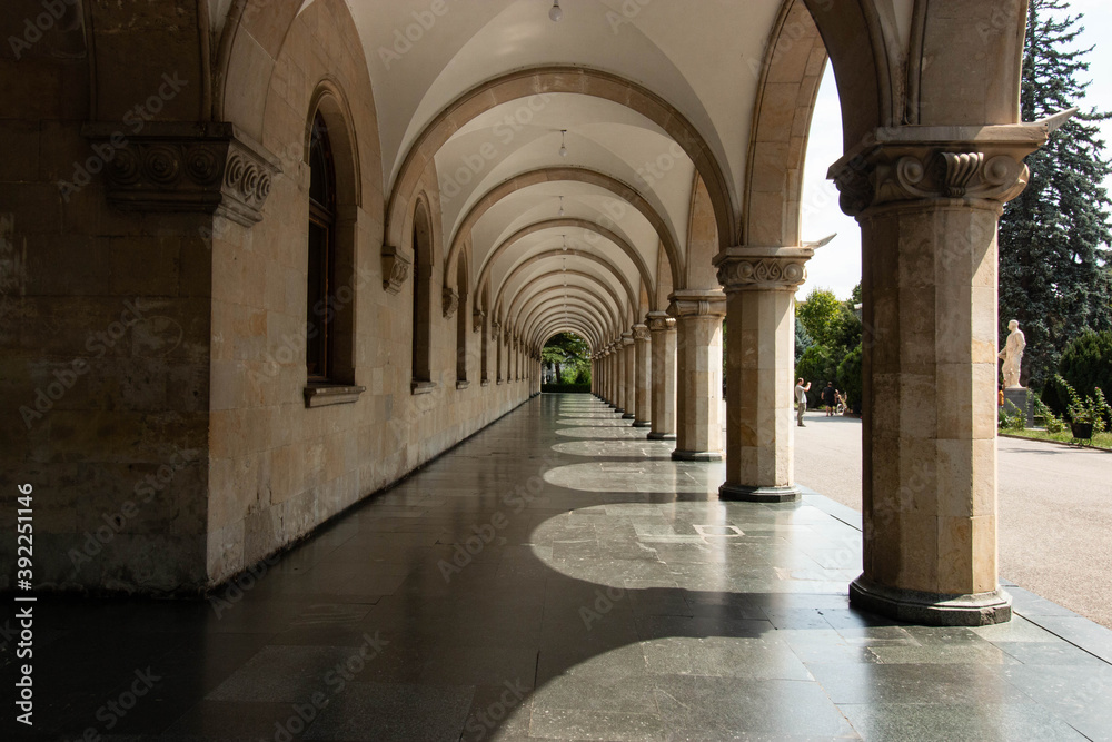 arched passage of a building with columns