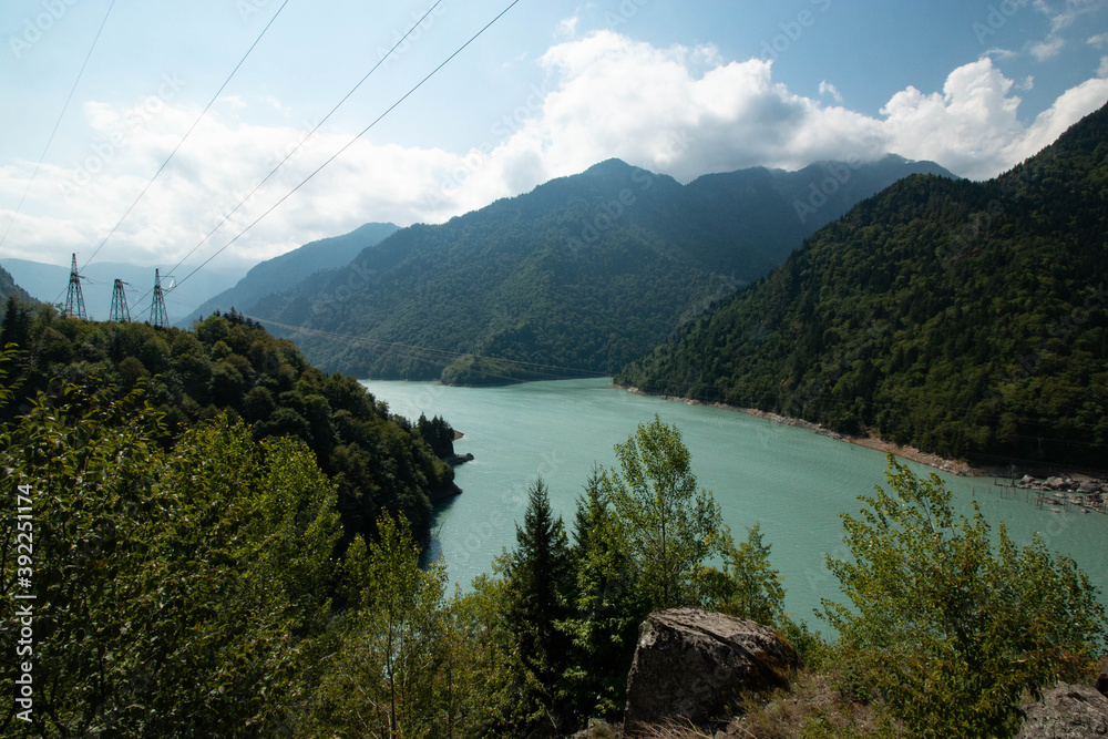 Fototapeta premium blue lake between green mountains