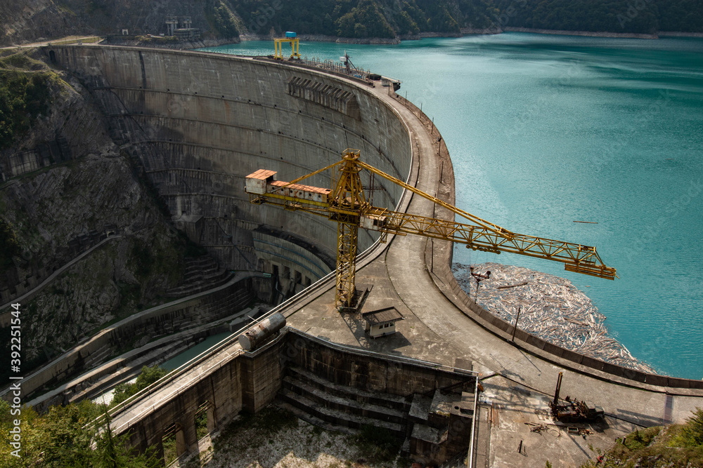 crane on a dam in the mountains