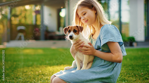 Canvas Print Cute Girl Holds Her Favourite Pedigree Dog Friend while Having Picnic Outdoors on the Lawn