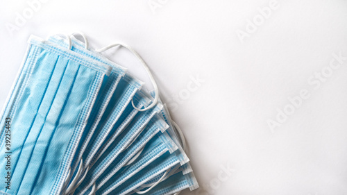 Close up of surgical/pandemic face masks on a white background