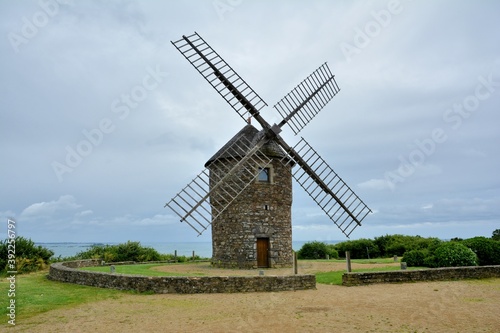 Old windmill in Normandy built in granite stones 