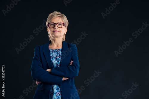 Heroshot of a confident older secretary looking at the camera photo