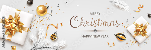 Horizontal banner with gold and silver Christmas symbols and text. Christmas tree, gifts, decoration and other festive elements on white background.