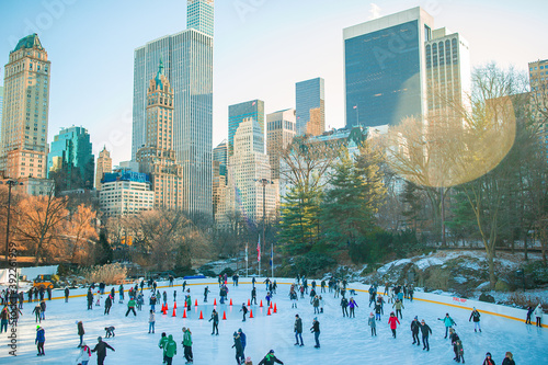 Ice skaters having fun in New York Central Park in winter © travnikovstudio