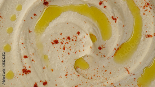 Fotografi hummus with smoked paprika and olive oil top view