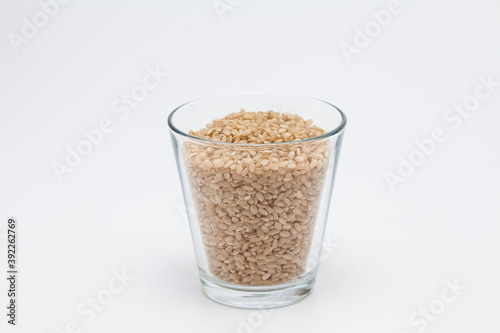 Brown rice, unpolished rice transparent glass cup