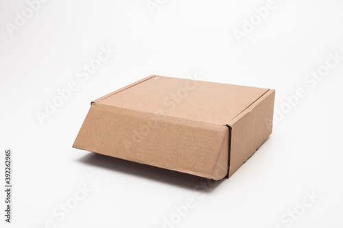 Cardboard Carry Box for Products On White Background Isolated © papii