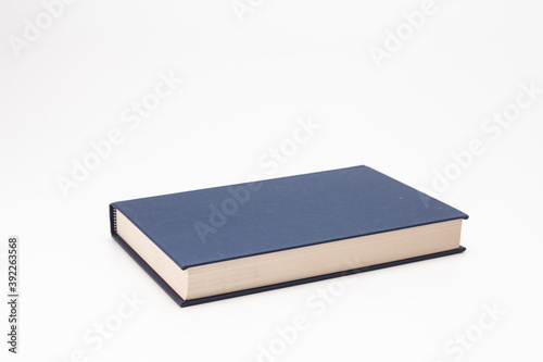 Dark blue book on white background