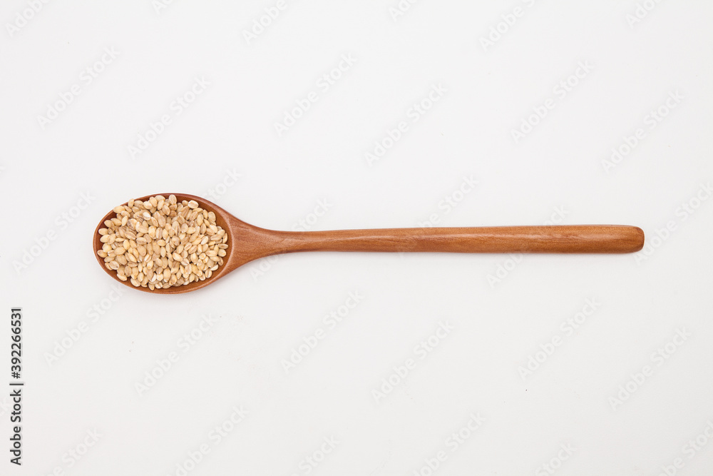 Wooden spoon with brown rice unpolished rice Wooden spoon with brown rice unpolished rice