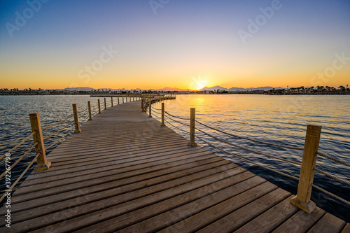 Wooden Pier on Red Sea in Hurghada at sunset, View of the promenade boardwalk - Egypt, Africa
