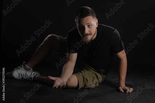 Funny guy posing on black backgroung. Isolated