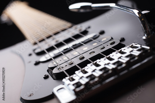 Photos Elegant electric guitar on black background close up point of view showing from