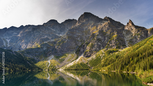 Fototapeta Naklejka Na Ścianę i Meble -  Landscapes with a tourist on a background of mountains and lakes with evening lighting