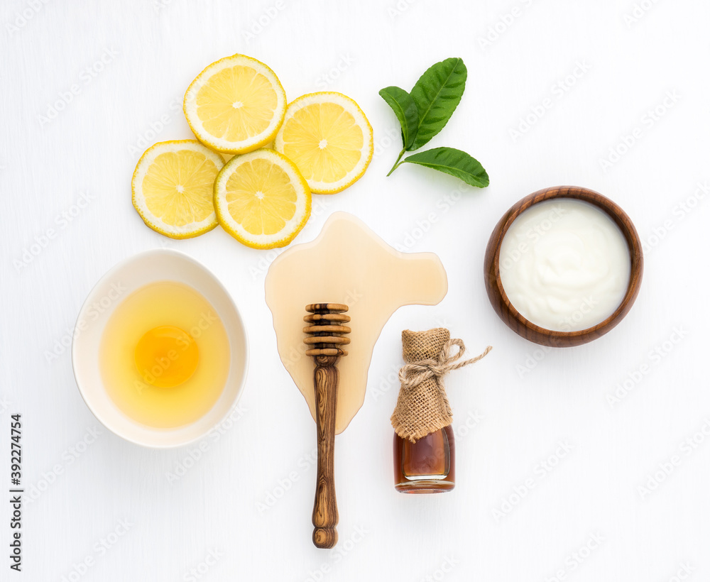 Top view of egg,yogurt,honey and lemon on white background in concept  simple homemade hair  hair care recipe with essential   natural hair care for long, strong and beautiful hair. Stock Photo |