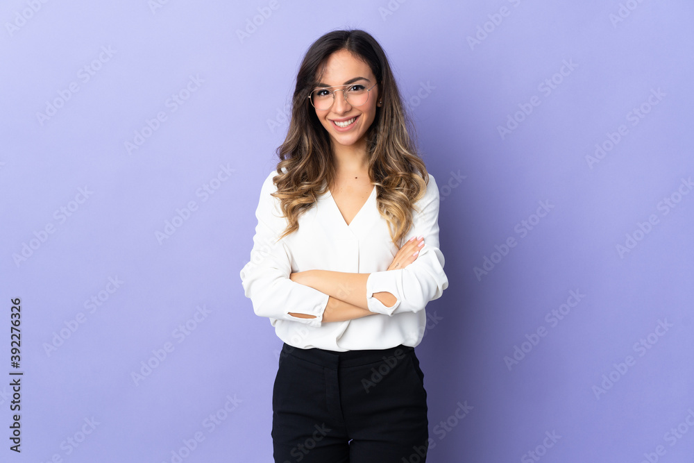 Young caucasian woman isolated on purple background keeping the arms crossed in frontal position Young caucasian woman isolated on purple background keeping the arms crossed in frontal position