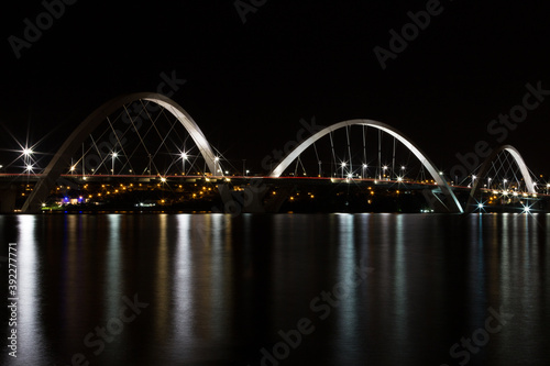 Night photo of the JK Bridge over Lake Paranoá in Brasilia, Brazil.