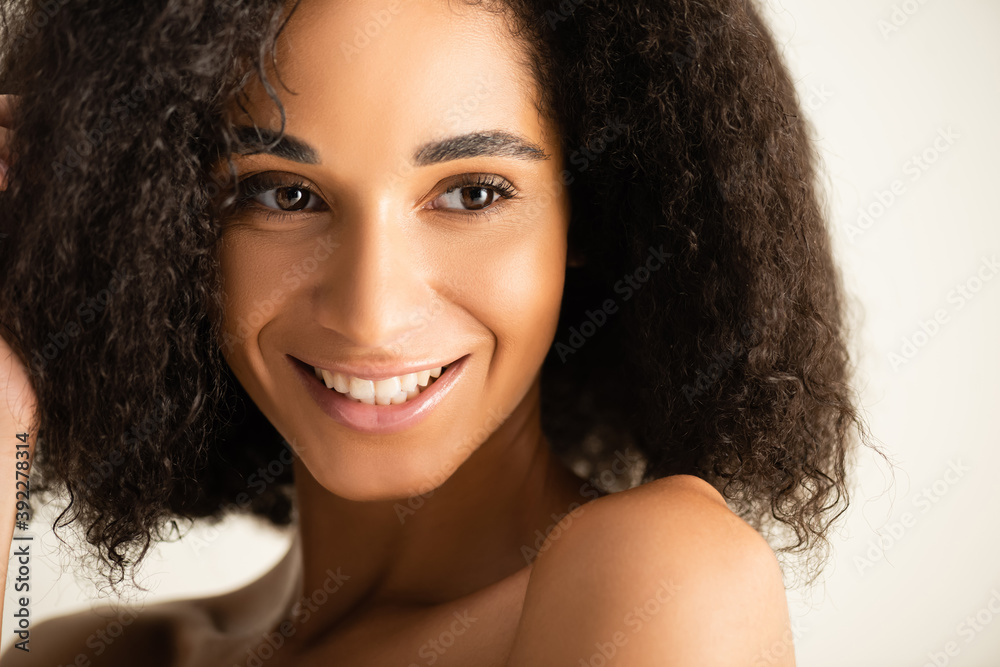 African american woman smiling and looking away isolated on white African american woman smiling and looking away isolated on white