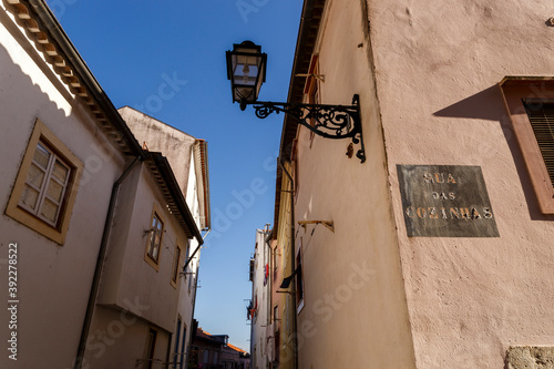 Detail of old city corner in Lisbon with street name sign in Portuguese 