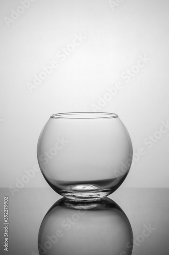 Transparent vase on a dark background with back light