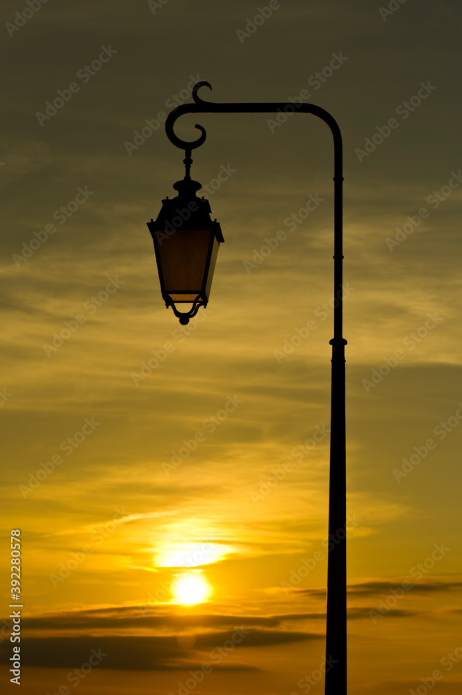 Street lamp at sunset, Charroux, Auvergne, France