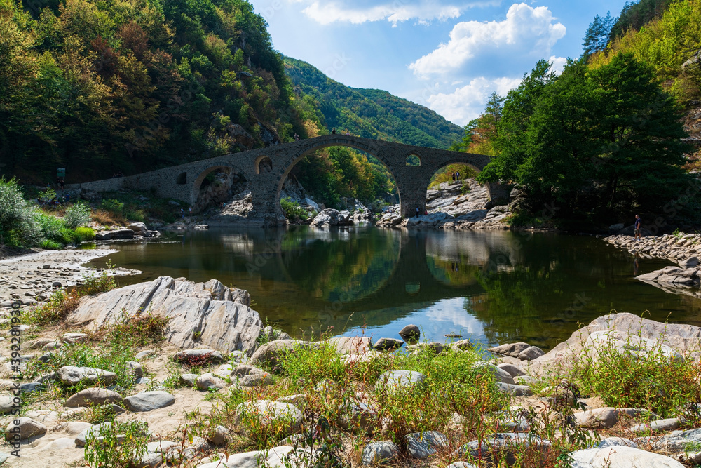 Devil's Bridge - an ancient stone bridge over the Arda River near Ardino Town, Bulgaria, Europe