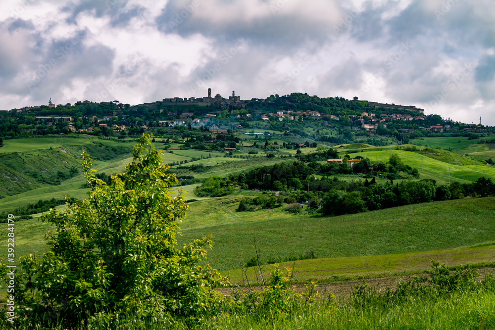 Mountainous landscape of Italian Tuscany. Cloudy day in the field. Typical view of the Italian north.
