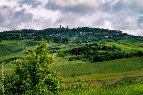Mountainous landscape of Italian Tuscany. Cloudy day in the field. Typical view of the Italian north.