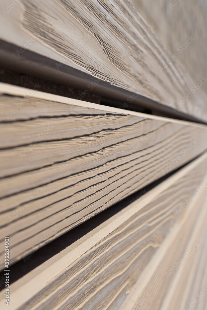 Wooden planks in perspective. Wooden grunge texture in perspective. Abstract wooden background. Fragment of a wooden bench. Grungy wood texture. A row of wood planks.