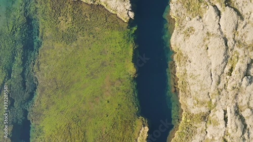 Aerial: Silfra popular diving / snorkeling fissure in Iceland between Eurasian and North American tectonic plates Thingvellir national park Phenomenal water clarity