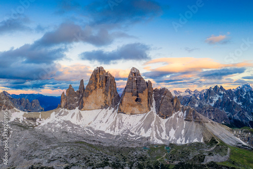 Aerial view of Tre Cime di Lavaredo and Grava Longa lakes at sunset, Sesto Dolomites Natural Park, South Tyrol, Italy photo