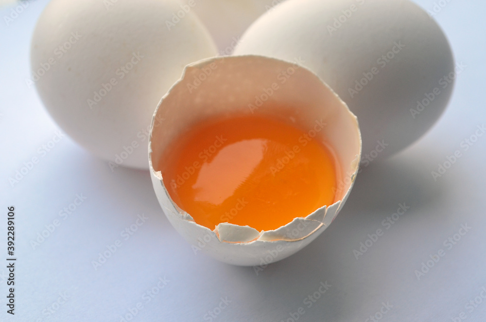 White chicken eggs on the table. orange yolk. Farm product, ingredients. Isolate. Easter. White chicken eggs on the table. orange yolk. Farm product, ingredients. Isolate. Easter.