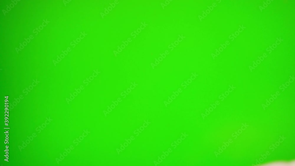 Hand Zooms on the Green Screen Layout Chroma Key Green Background. Surfing the Internet, Viewing Content, Video Blogs, Close-up Hand Zooms on the Green Screen Layout Chroma Key Green Background. Surfing the Internet, Viewing Content, Video Blogs, Close-up