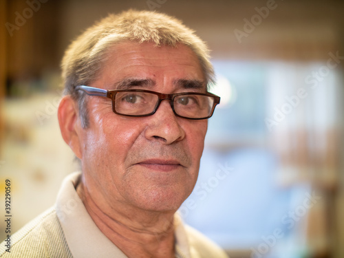 Smiling happy healthy young looking senior man in glasses, portrait, closeup.