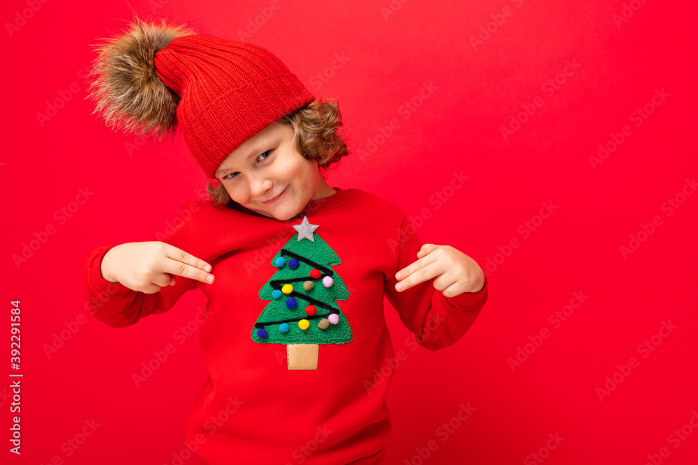 emotional portrait of a teenager on a red background in a new year costume emotional portrait of a teenager on a red background in a new year costume