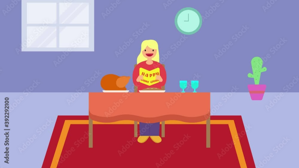 Woman reads thanksgiving greeting card at dinner Woman reads thanksgiving greeting card at dinner