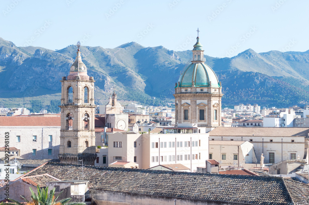 Urban landscape of Palermo the main city of Sicily in Italy. Here the roof and of the old houses with the mountains in the background seen from the St. Catherine's Monastery terraces