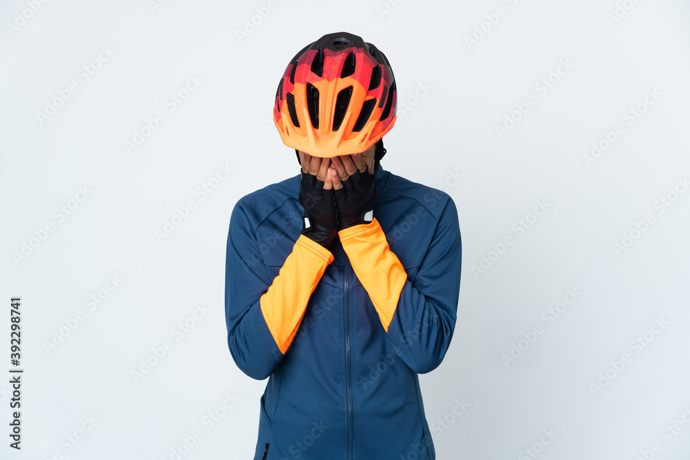 Young cyclist Brazilian man isolated on white background with tired and sick expression - obrazy, fototapety, plakaty 