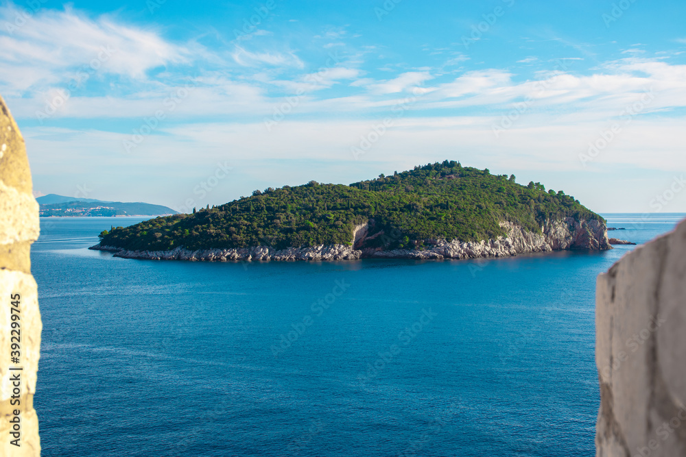 Lokrum island near the town of Dubrovnik, beautiful natural preserved parkland overgrown with lush trees and natural park. Seen while walking along the city walls