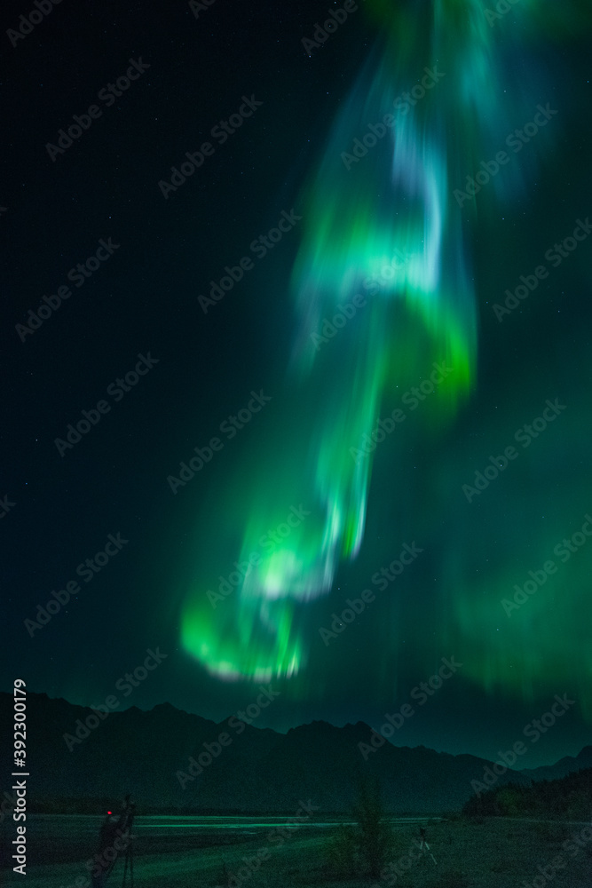 Big Aurora over Alaskan river.